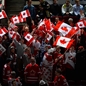 MALMO, SWEDEN - JANUARY 4: A lot of Canadian flags were waved in the stands by the fans prior to semifinal round action between Canada and Finland at the 2014 IIHF World Junior Championship. (Photo by Francois Laplante/HHOF-IIHF Images)